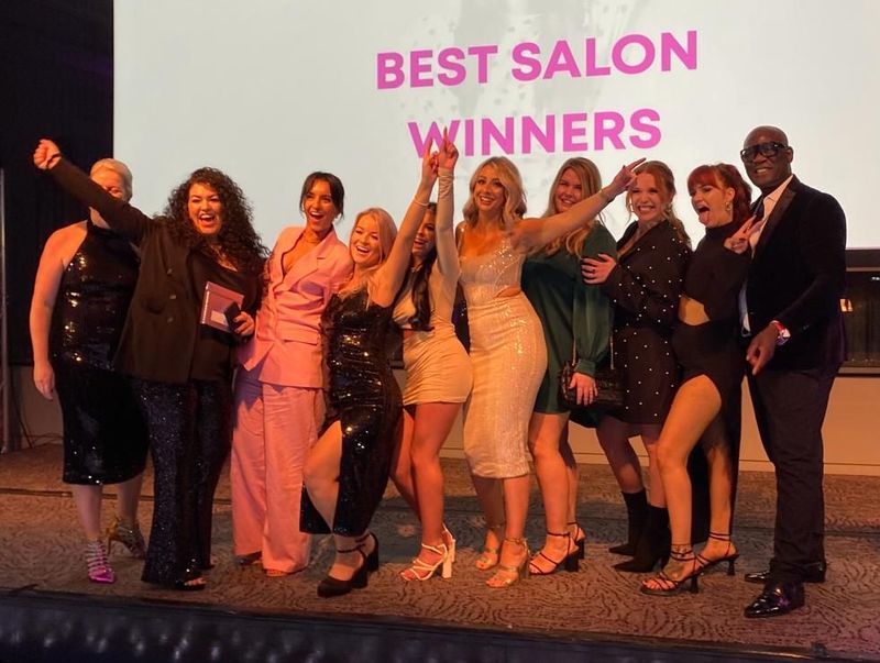 The team from Head Office Creative Hair Studios on stage at the Salon Awards 2022 accepting their award for 'Best Salon'